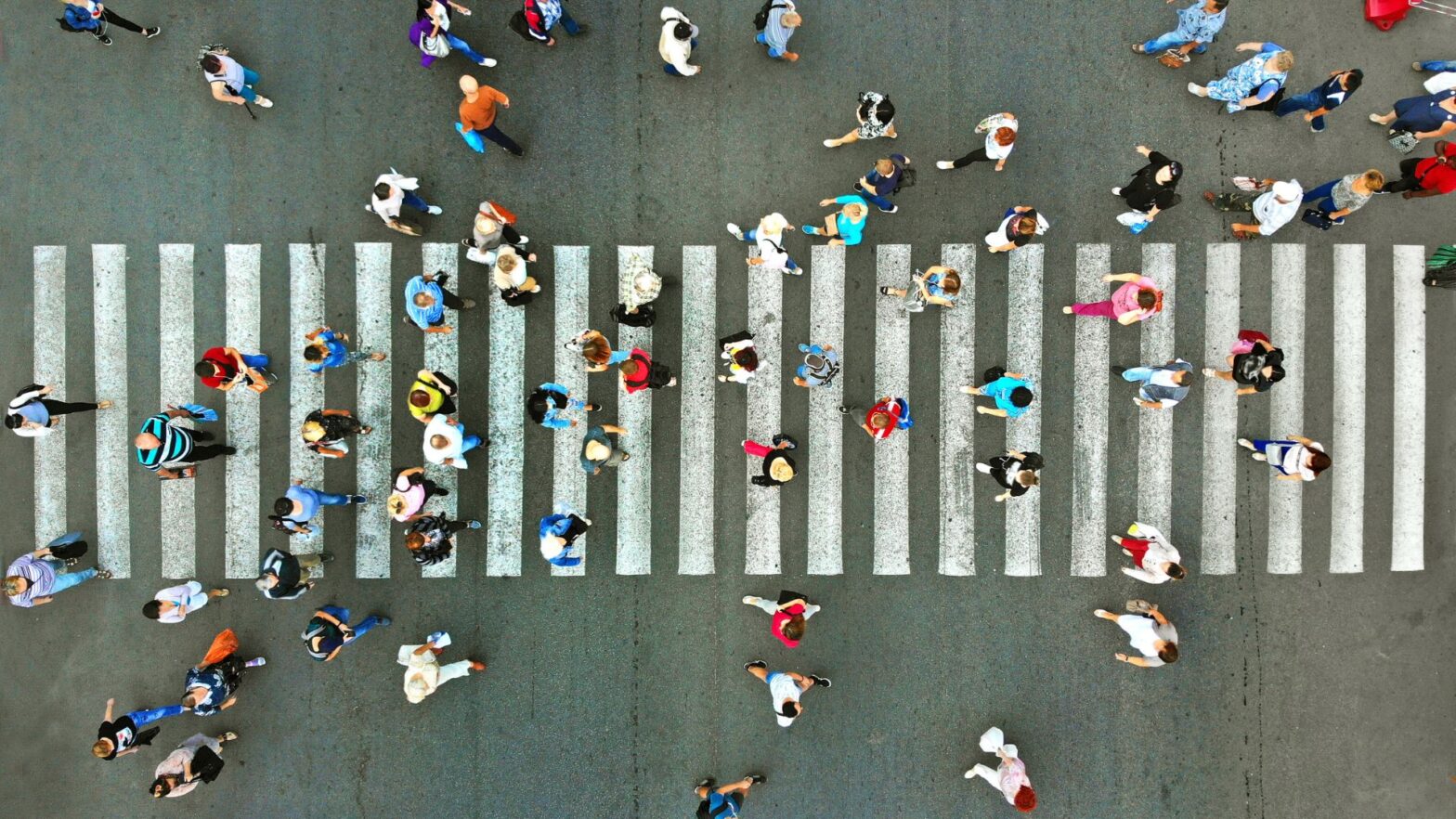 People crossing the road over a zebra crossing